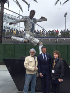 Julie Rotblatt Amrany with David Beckham and his bronze sculpture