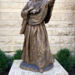 bronze statue of sainted woman