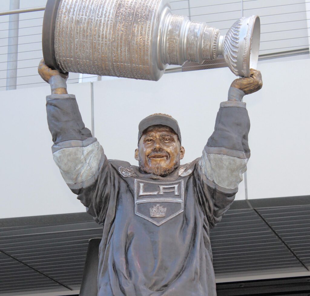 bronze statue of Dustin Brown of LA Kings holding Stanley Cup