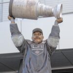 bronze statue of Dustin Brown of LA Kings holding Stanley Cup